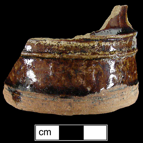Manganese Mottled small mug or tankard (2.25 inch base diameter) with cordoning at foot band and on body. The foot and base of the vessel are unglazed - collected by George L. Miller in 1986 in Staffordshire in Hanley. Cannot be attributed to a specific pottery.